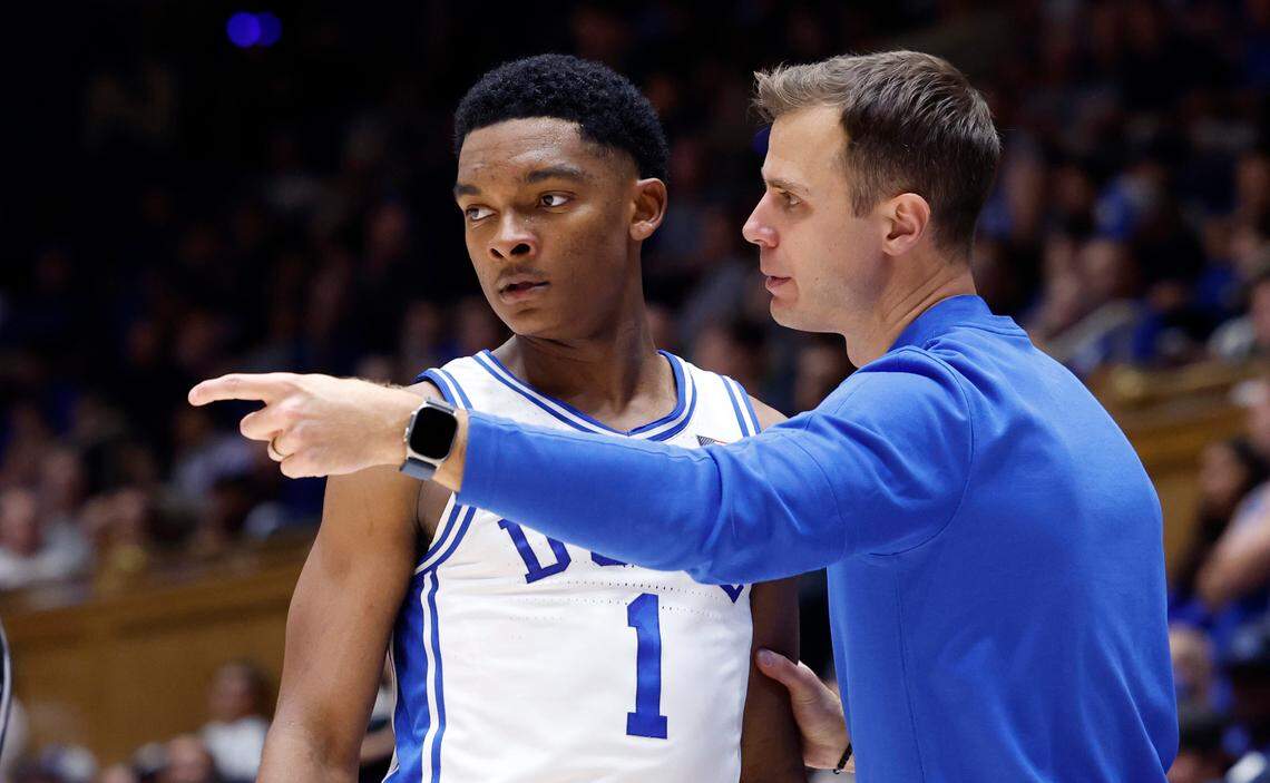 Duke head coach Jon Scheyer talks with Caleb Foster (1) during the second half of Duke’s 92-54 victory over Dartmouth at Cameron Indoor Stadium in Durham, N.C., Monday, Nov. 6, 2023.