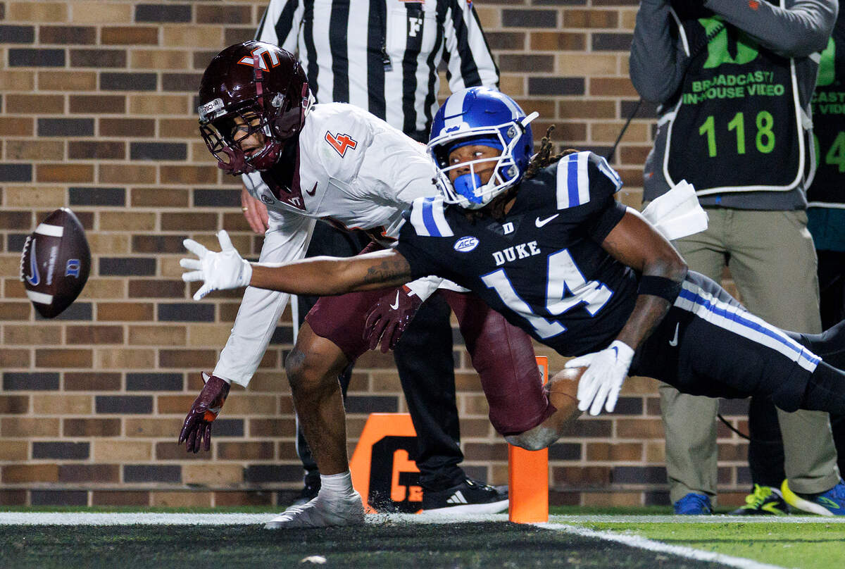 Virginia Tech’s Mansoor Delane pressures a pass intended for Duke’s Que’Sean Brown during the second half of the Blue Devils’ 31-28 win on Saturday, Nov. 23, 2024, at Wallace Wade Stadium in Durham, N.C.