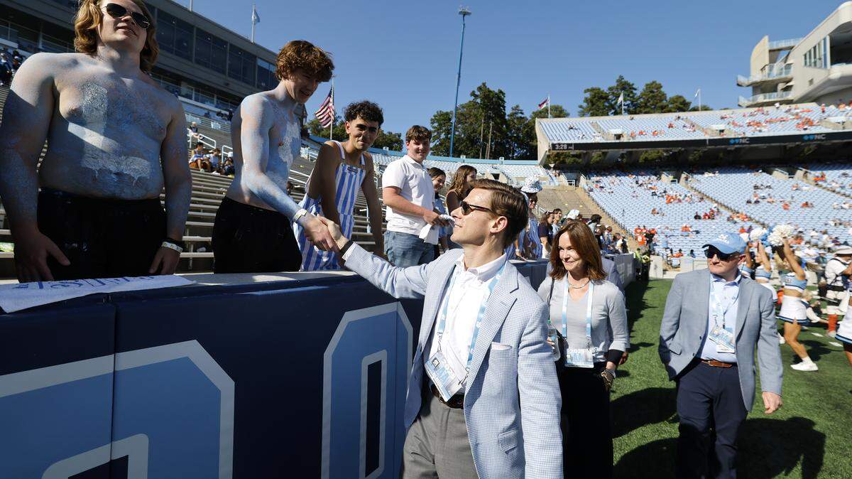 UNC Chancellor Lee Roberts greets fans late in the second half of Clemson’s 38-10 victory over UNC at Kenan Stadium in Chapel Hill, N.C., Sat. Oct. 4, 2025.