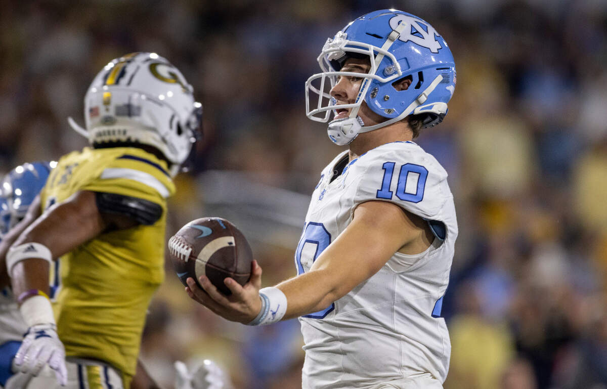 North Carolina quarterback Drake Maye (10) scores on a 14-yard run in the third quarter to give the Tar Heels’ a 35-24 lead against Georgia Tech on Saturday, October 28, 2023 at Bobby Dodd Stadium in Atlanta, Georgia.