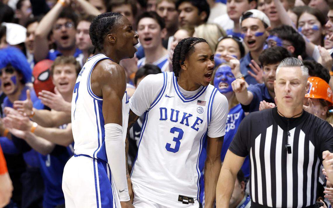 Duke’s Isaiah Evans (3) and Dame Sarr (7) celebrate after forcing a Virginia turnover during the first half of Duke’s game against Virginia at Cameron Indoor Stadium in Durham, N.C., Saturday, Feb. 28, 2026.