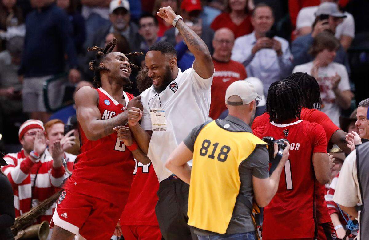 N.C. State’s Kam Woods celebrates following the Wolfpack’s 67-58 win over Marquette in the NCAA Tournament Sweet 16 on Friday, March 29, 2024, at American Airlines Center in Dallas, Texas.