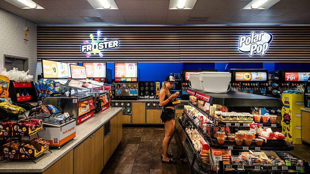 A young woman shopping among the food and beverage stands at a Circle K gas station in Marathon Key on the Florida Keys highway in the United States of America (USA) on July 30, 2025. (Photo by Jc Milhet / Hans Lucas via AFP) (Photo by JC MILHET/Hans Lucas/AFP via Getty Images)