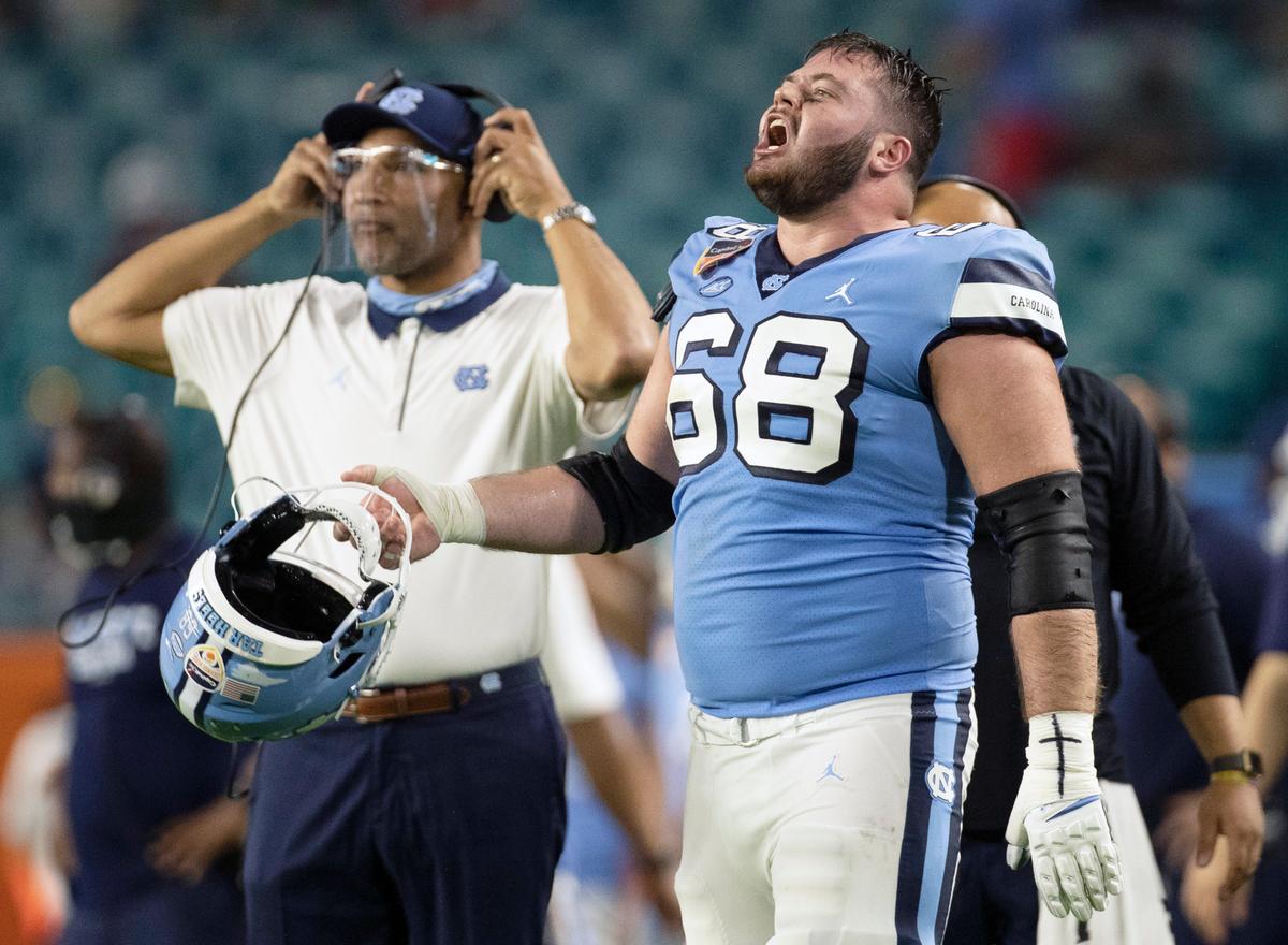 North Carolina’s Brian Anderson (68) reacts after a review of a touchdown by teammate Dazz Newsome is confirmed in the second quarter to give the Tar Heels’ a 13-10 lead during the Capital One Orange Bowl on Saturday, January 2, 2021in Miami Gardens, Florida.