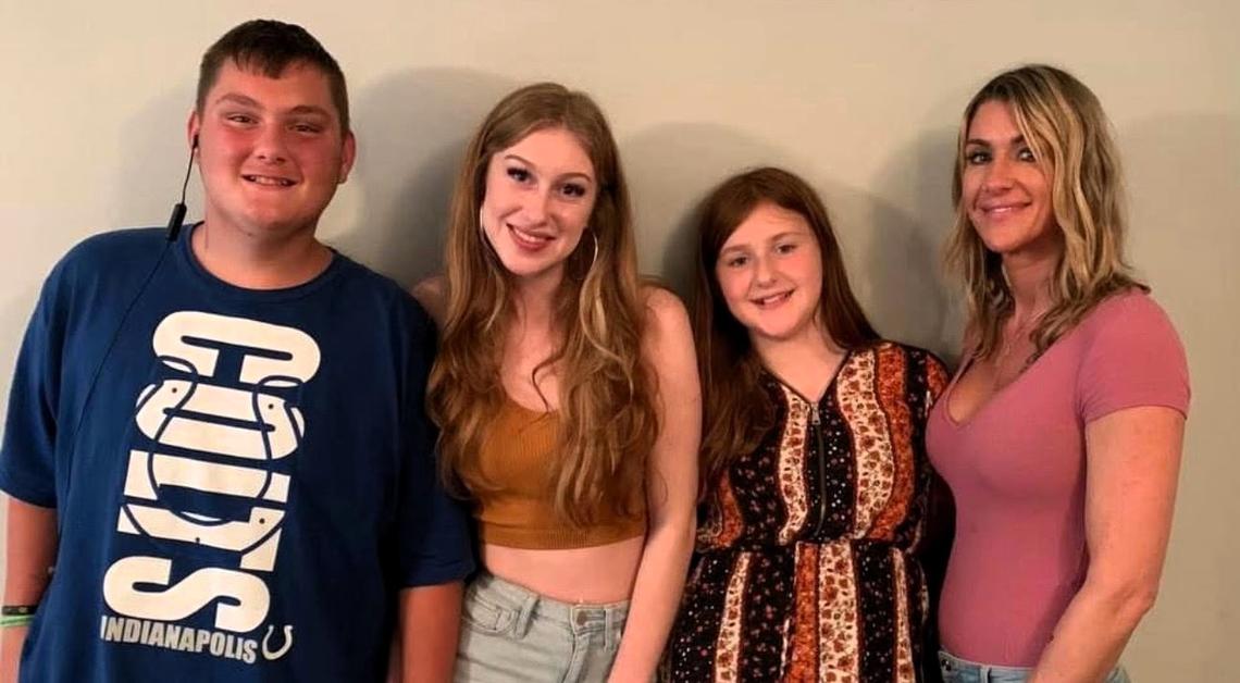 Ashley Lane (far right) poses for a photo with her son Ashton (from left), eldest daughter Alyssa and youngest daughter Cali.