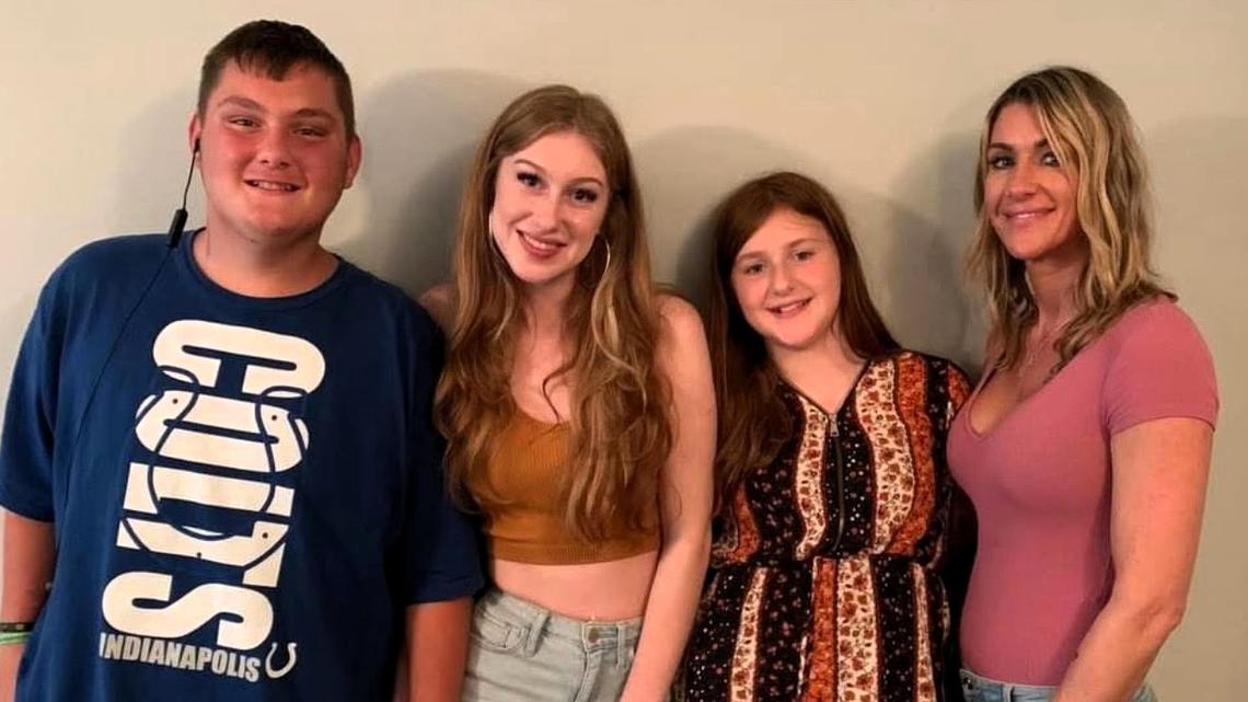 Ashley Lane (far right) poses for a photo with her son Ashton (from left), eldest daughter Alyssa and youngest daughter Cali.