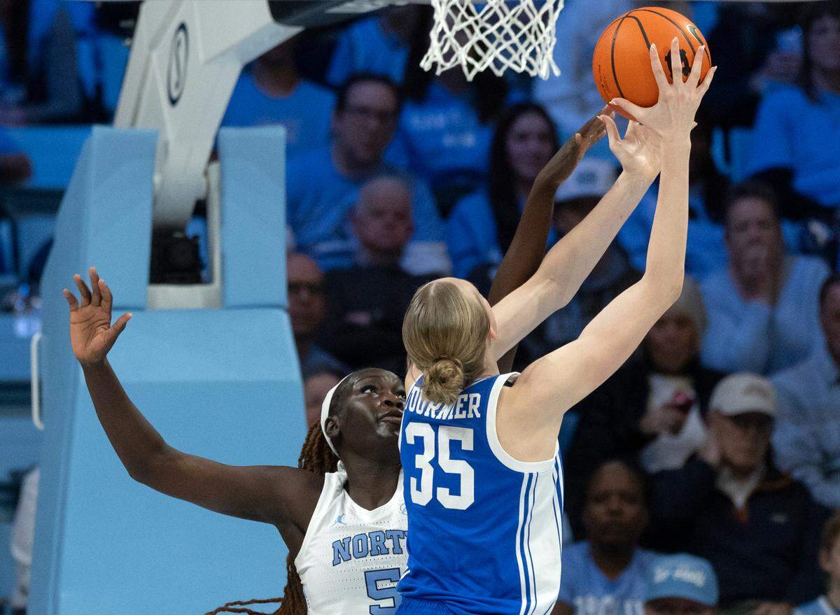 North Carolina’s Maria Gakdeng contests a shot by Duke’s Toby Fournier during the first half of the Tar Heels’ 53-46 overtime victory on Thursday, Jan. 9, 2025, at Carmichael Arena in Chapel Hill, N.C.