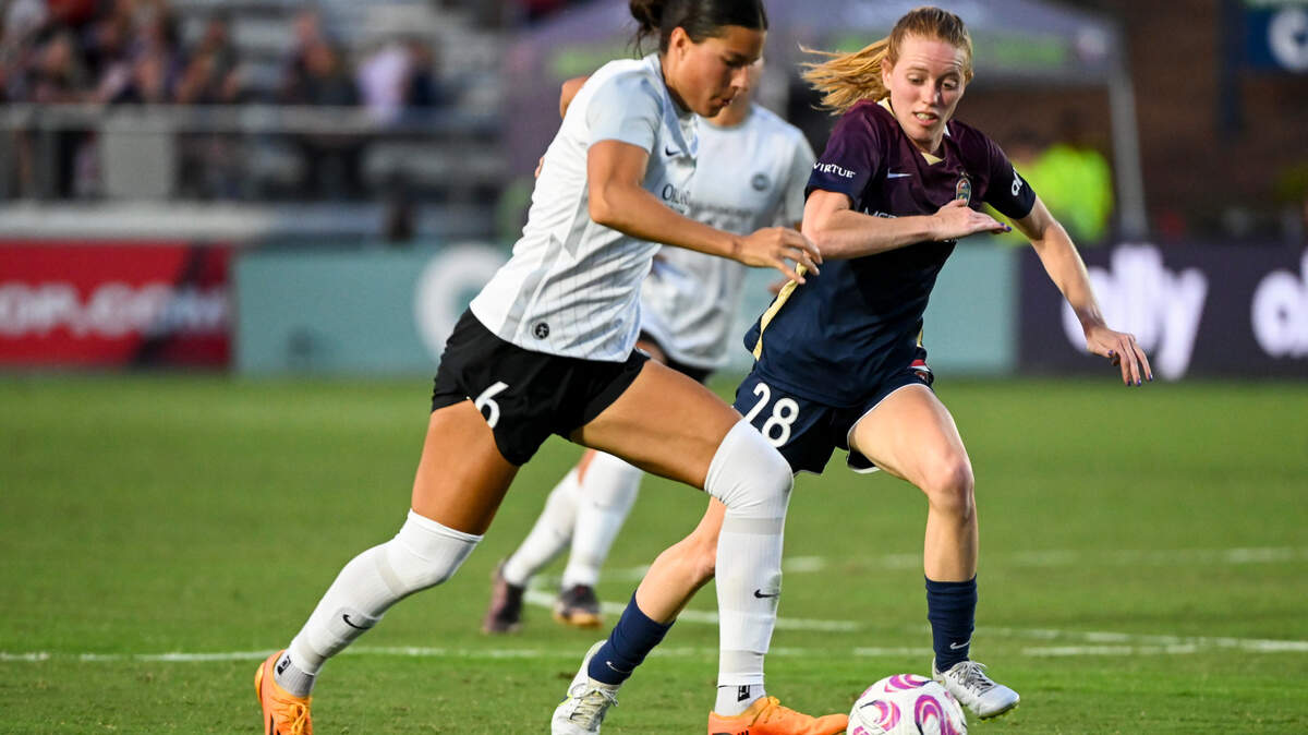 North Carolina Courage forward Tess Boade (28) challenges Orlando Pride defender Emily Madril (6) for the ball in the second half at WakeMed Soccer Park.