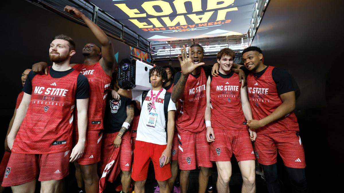 With Kaden Keatts holding the boom box, N.C. State players wait to take the court for their open practice at State Farm Stadium in Glendale, Ariz., Friday, April 5, 2024. The Wolfpack will face Purdue in the NCAA Tournament national semifinals Saturday.