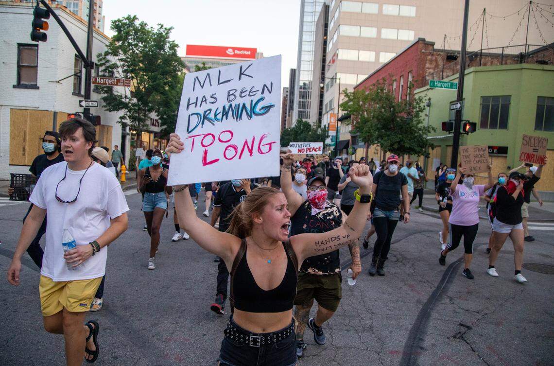 About 100 protesters march past curfew in downtown Raleigh Wednesday, June 3, 2020. Raleigh Police Chief Cassandra Deck-Brown met with protesters and allowed them to protest until 9:45 p.m. on the condition that they would disperse and return to their homes.