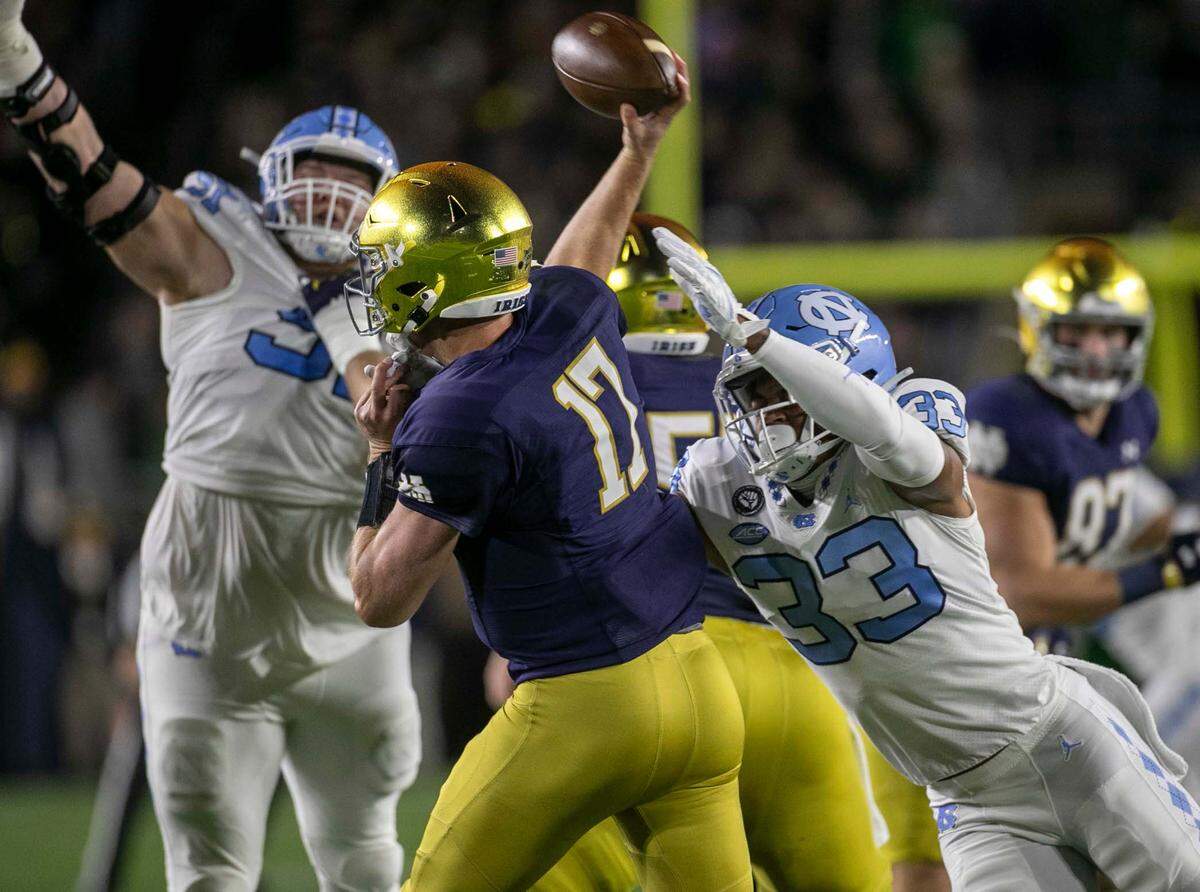 North Carolina Cedric Gray (33) pressures Notre Dame quarterback Jack Coan (17) in the first quarter on Saturday, October 30, 2021 in South Bend, Ind.