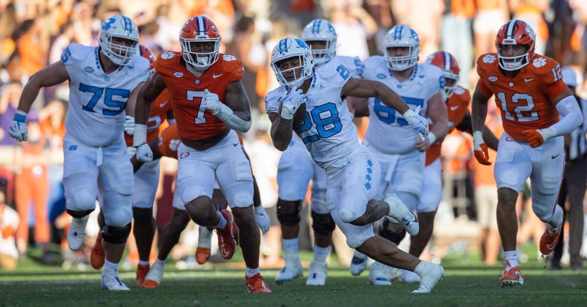 North Carolina’s Omarion Hampton (28) breaks open on a 64-yard run in the first quarter on Saturday, November 18, 2023 at Memorial Stadium in Clemson, S.C.