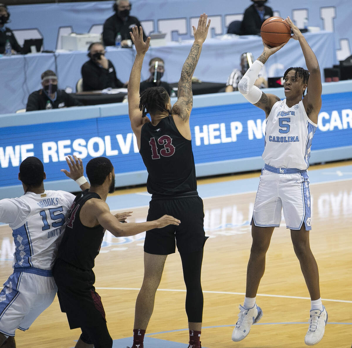 North Carolina’s Armando Bacot (5) puts up a shot over NCCU’s Justin Whatley (13) during the second half on Saturday, December 12, 2020 at the Smith Center in Chapel Hill, N.C. Bacot lead North Carolina with 19 points in their 73-67 victory.
