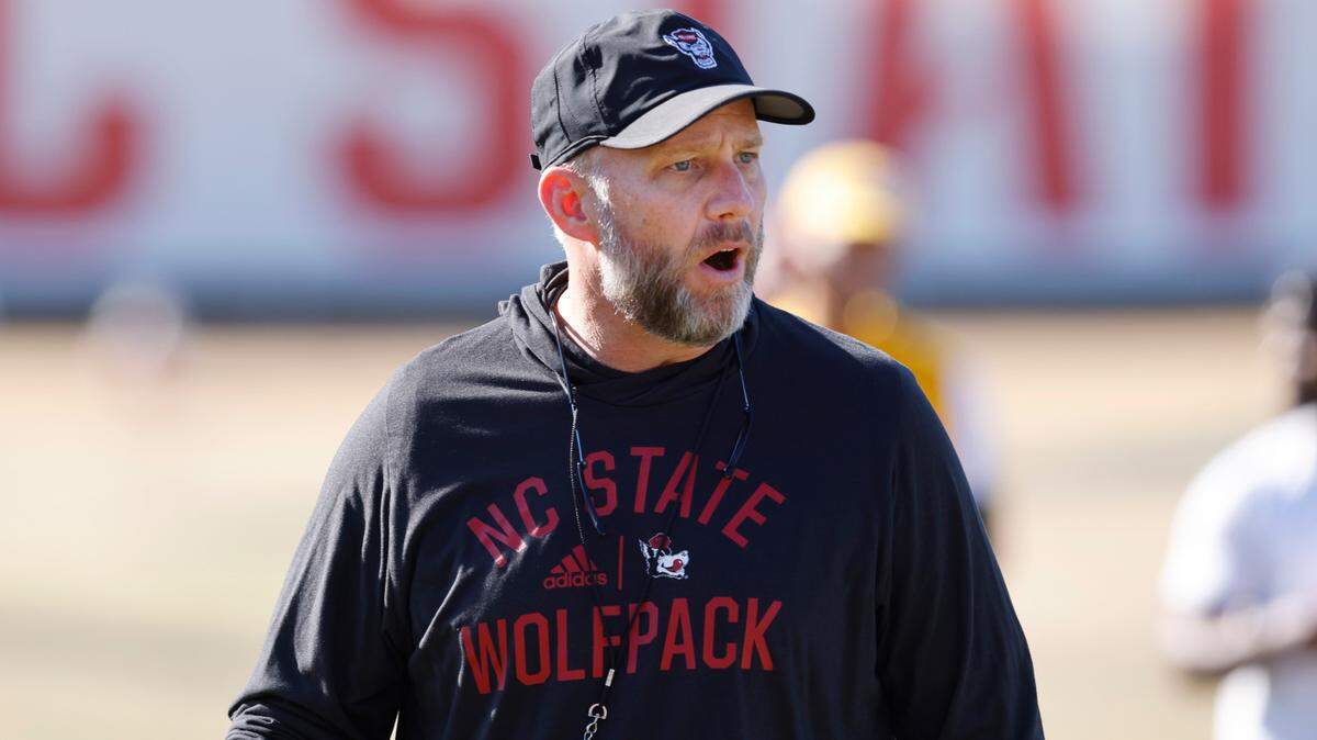 N.C. State head coach Dave Doeren speaks to his players during the first day of the Wolfpack’s spring football practice in Raleigh, N.C., Wednesday, March 2, 2022.