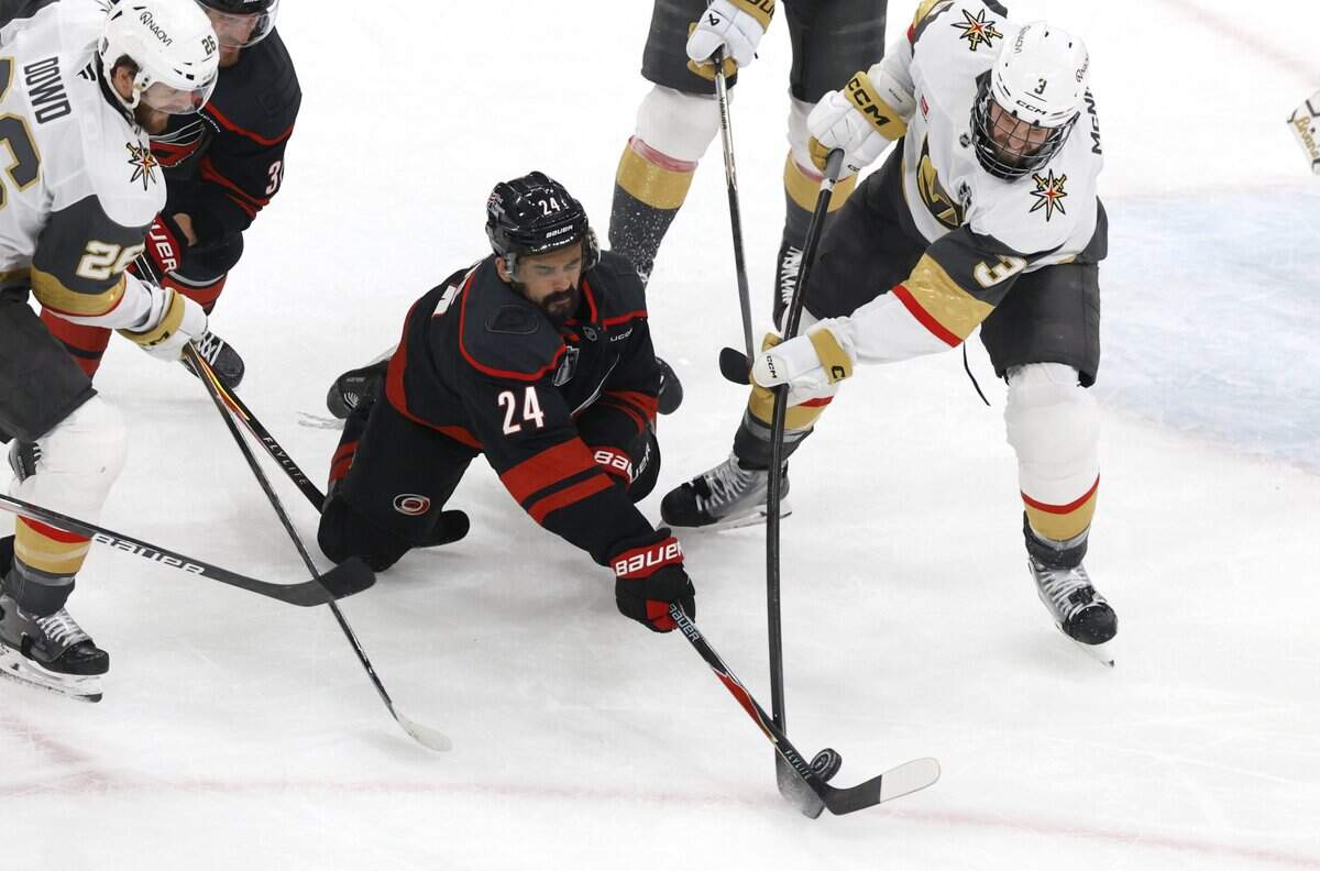 Carolina's Seth Jarvis (24) dives for the puck in the second period of the Hurricanes’ game against the Golden Knights in the fifth game of the Stanley Cup Final at the Lenovo Center in Raleigh, N.C., Thursday, June 11, 2026.