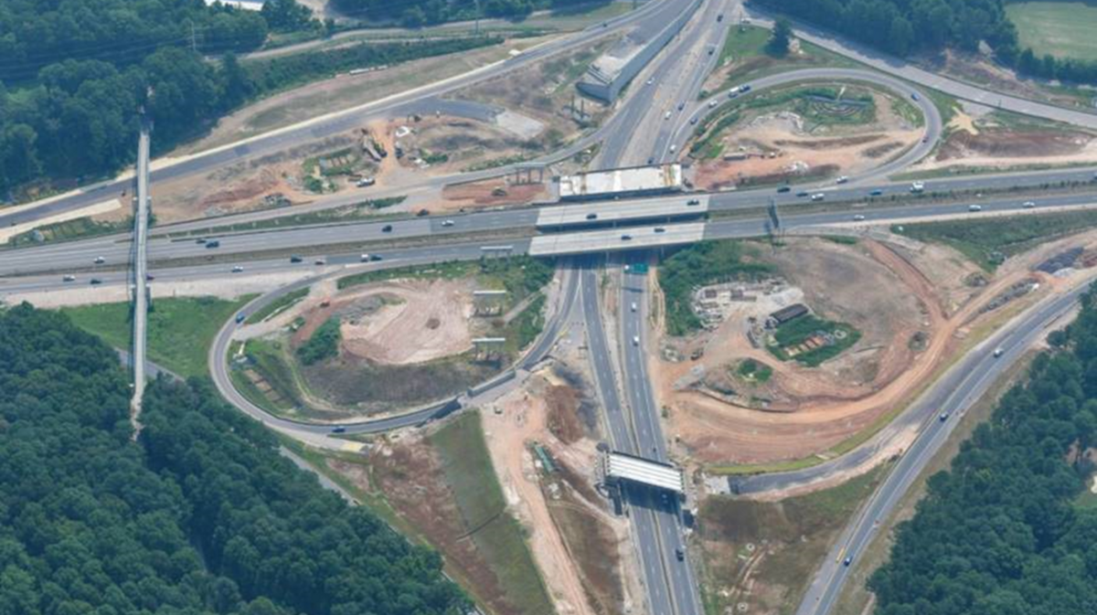 Raleigh architect Ted Van Dyk says this NC DOT photo of the Wade Avenue/Beltline interchange shows a major scalping of trees. He advocates that North Carolina use money from the federal infrastructure bill to replenish trees on projects like this.