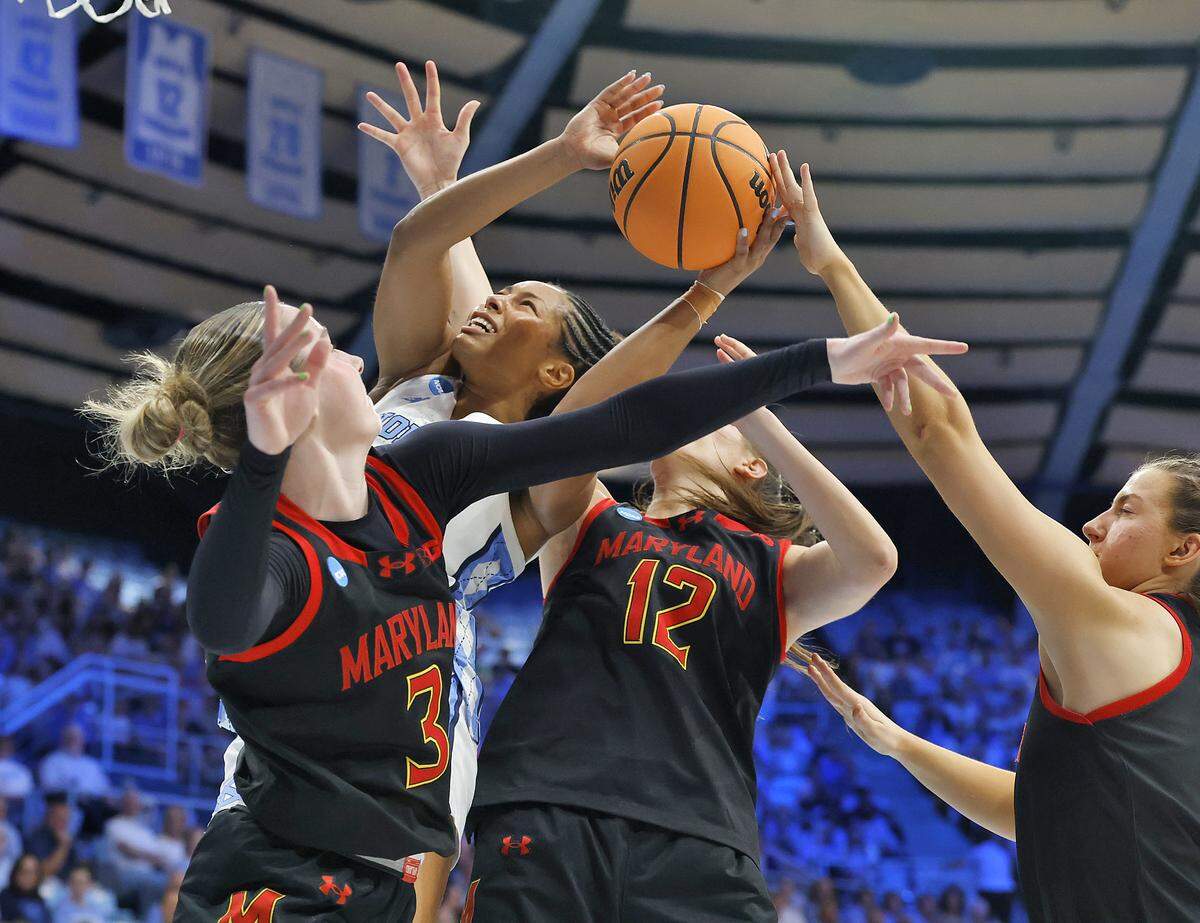 North Carolina’s Indya Nivar puts up a shot over Maryland’s Addi Mack (3) and Yarden Garzon (12) during the first half of the Tar Heels’ second-round NCAA Tournament game on Sunday, March 22, 2026, at Carmichael Arena in Chapel Hill, N.C.