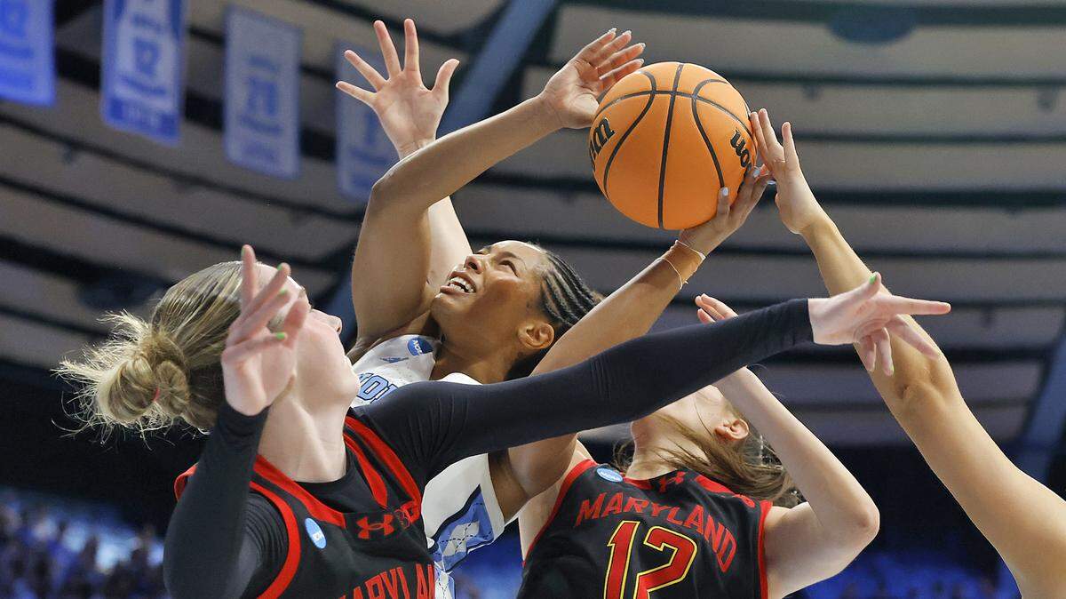 North Carolina’s Indya Nivar puts up a shot over Maryland’s Addi Mack (3) and Yarden Garzon (12) during the first half of the Tar Heels’ second-round NCAA Tournament game on Sunday, March 22, 2026, at Carmichael Arena in Chapel Hill, N.C.