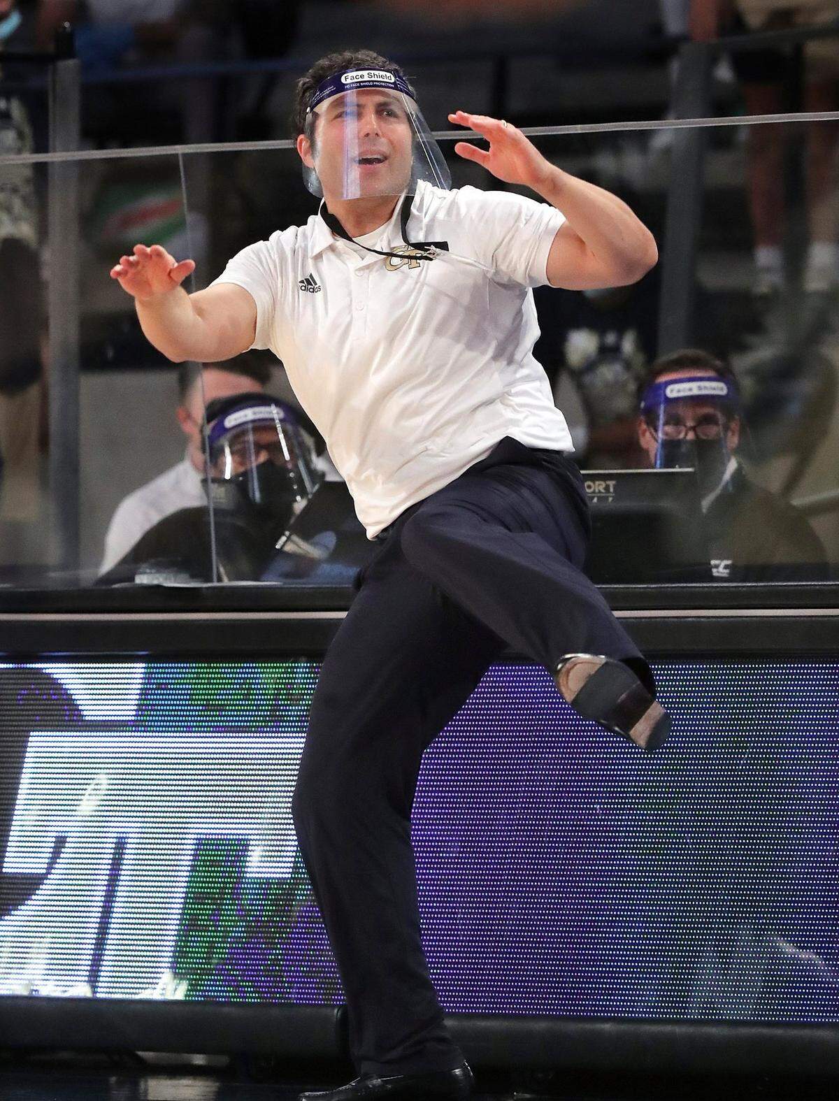 Georgia Tech head coach Josh Pastner uses some body English and a leg kick while coaching his team to a come from behind 72-67 victory over North Carolina during an NCAA college basketball game Wednesday, Dec. 30, 2020, in Atlanta.