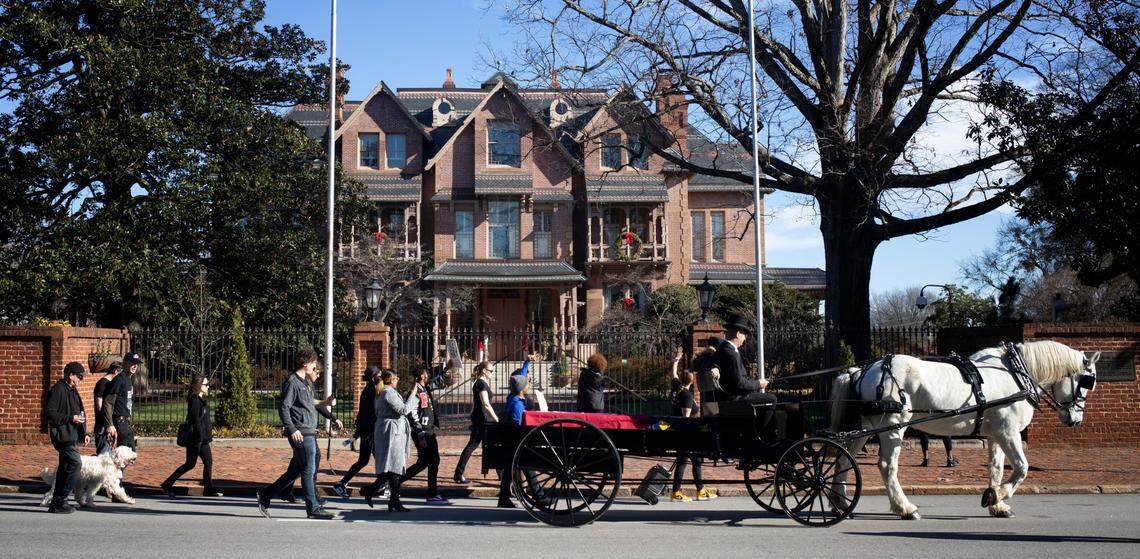 Protesters march around the Governor’s Mansion in Raleigh in early January following a horse-drawn carriage with a mock coffin draped in the NC state flag. They were calling attention to prisoners who had died in prison, especially by suicide, and calling for the release of others.