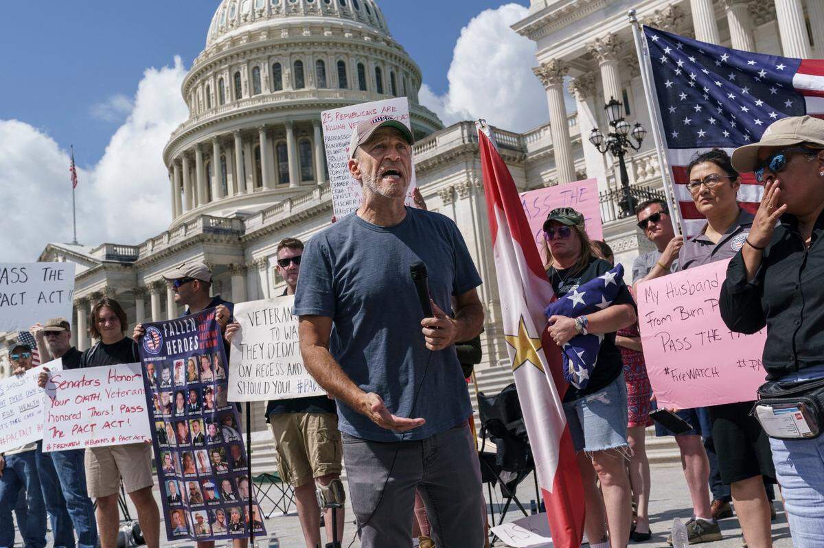 Veterans, military family members and advocates are joined by activist Jon Stewart as they call for Senate Republicans to change their votes on a bill designed to help millions of veterans exposed to toxic substances during their military service, at the Capitol in Washington, Monday, Aug. 1, 2021. A bill that enhances health care and disability benefits for millions of veterans exposed to toxic burn pits has hit a snag in the Senate. 