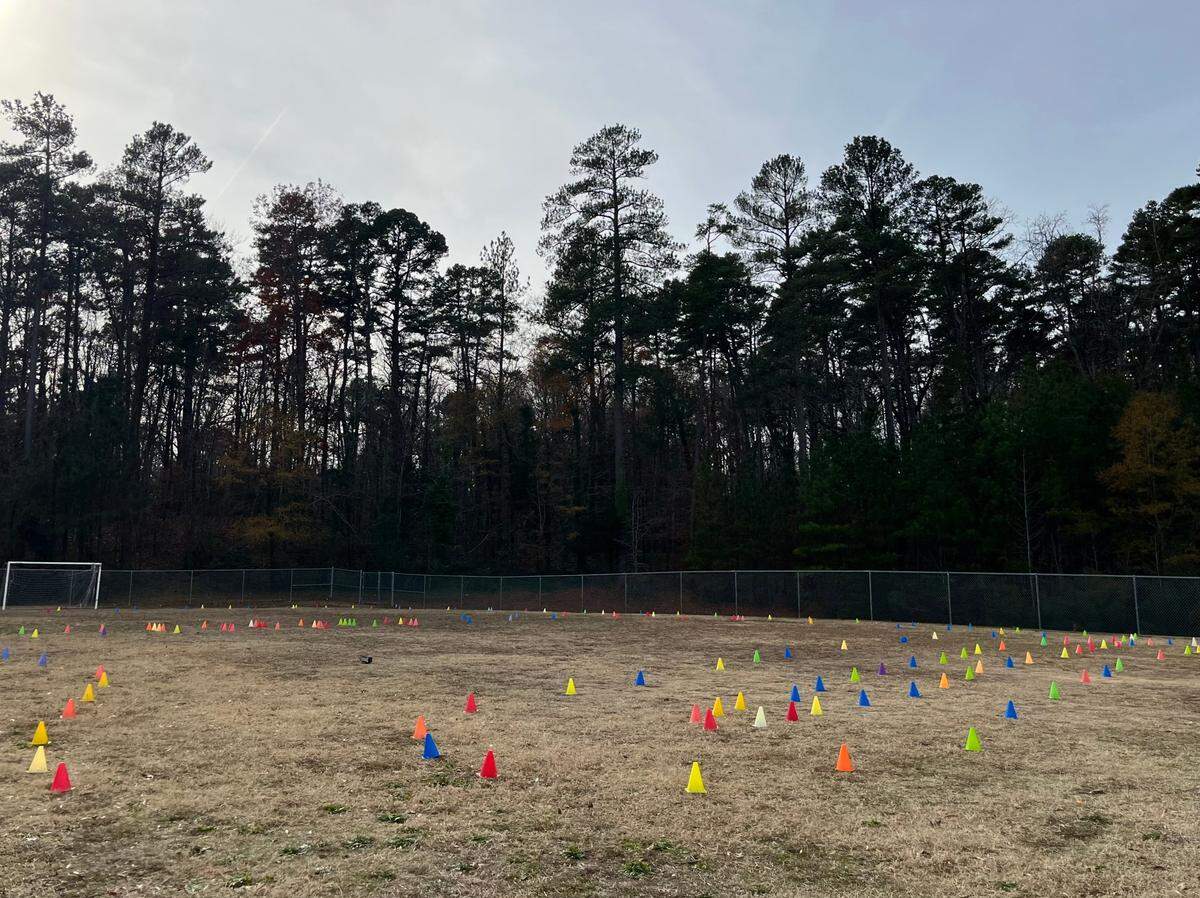 The soccer field at Lakewood Elementary School is set up with cones for bike lessons on Saturday, Dec. 14, 2024, in Durham, N.C.