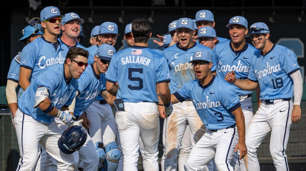 North Carolina infielder Lee Sowers (3) and his teammates greet third baseman Gavin Gallaher (5) after a solo home run in the eighth inning to take an 11-3 lead over Oklahoma during Game 7 of the NCAA Chapel Hill Regional on Monday, June 2, 2025 at Boshamer Stadium in Chapel Hill, N.C.
