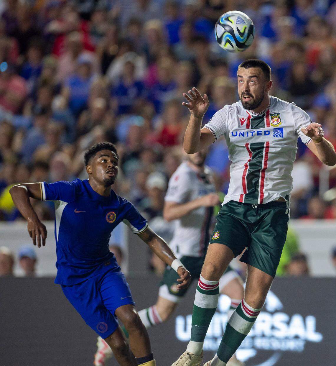 Wrexham’s Eoghan O’Connell (15) controls a header over Chelsea during the first half of the FC Series game against Chelsea on Wednesday, July 19, 2023 in Chapel Hill, N.C.