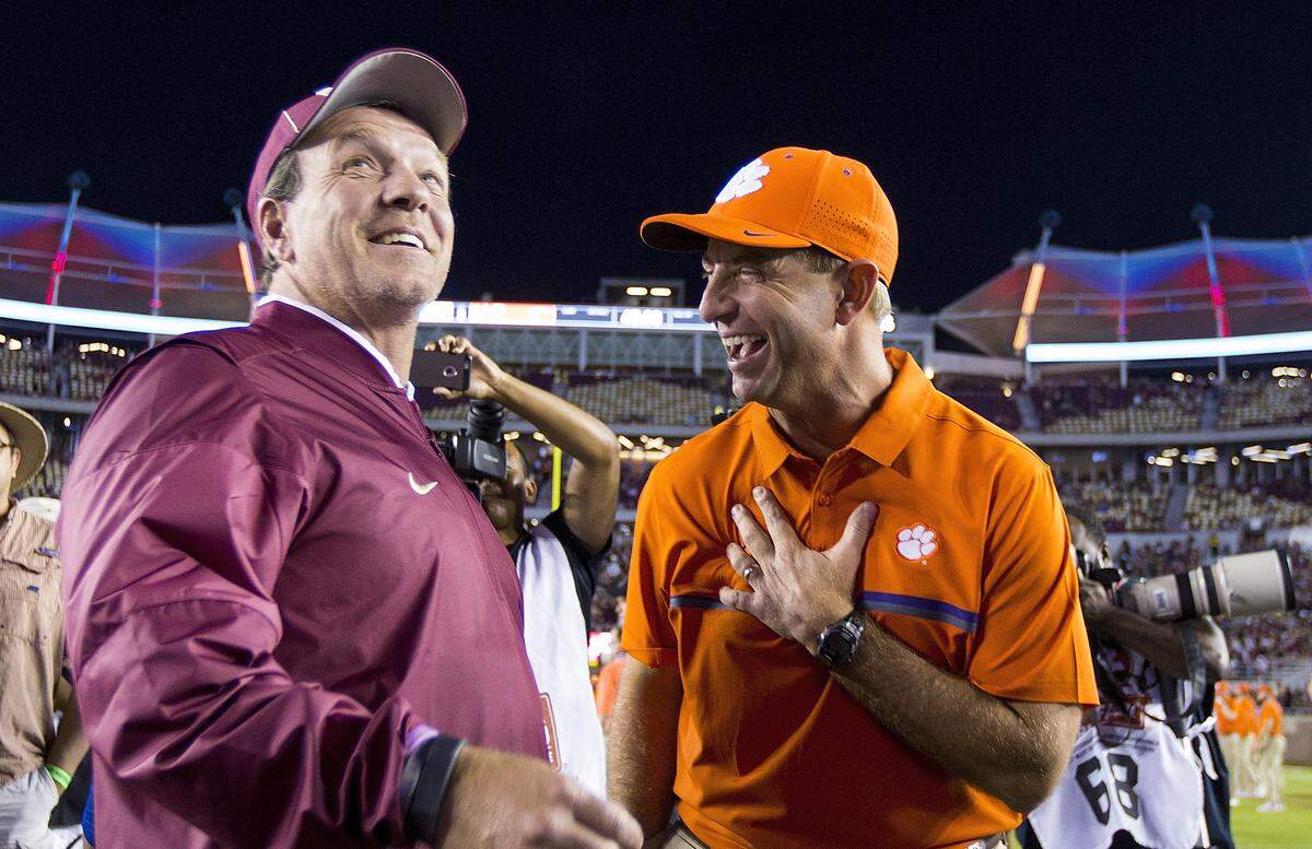 Florida State coach Jimbo Fisher, left, talks with Clemson coach Dabo Swinney before their game in Tallahassee, Fla. in Oct. 2016.