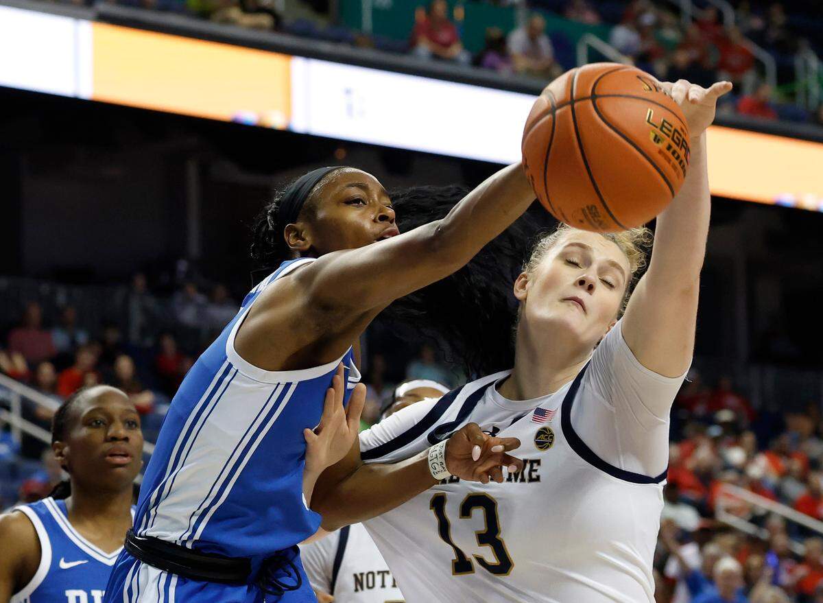 Duke’s Oluchi Okananwa and Notre Dame’s Kate Koval battle for a rebound during the first half of the Blue Devils’ ACC Tournament semifinal game on Saturday, March 8, 2025, at First Horizon Coliseum in Greensboro, N.C.