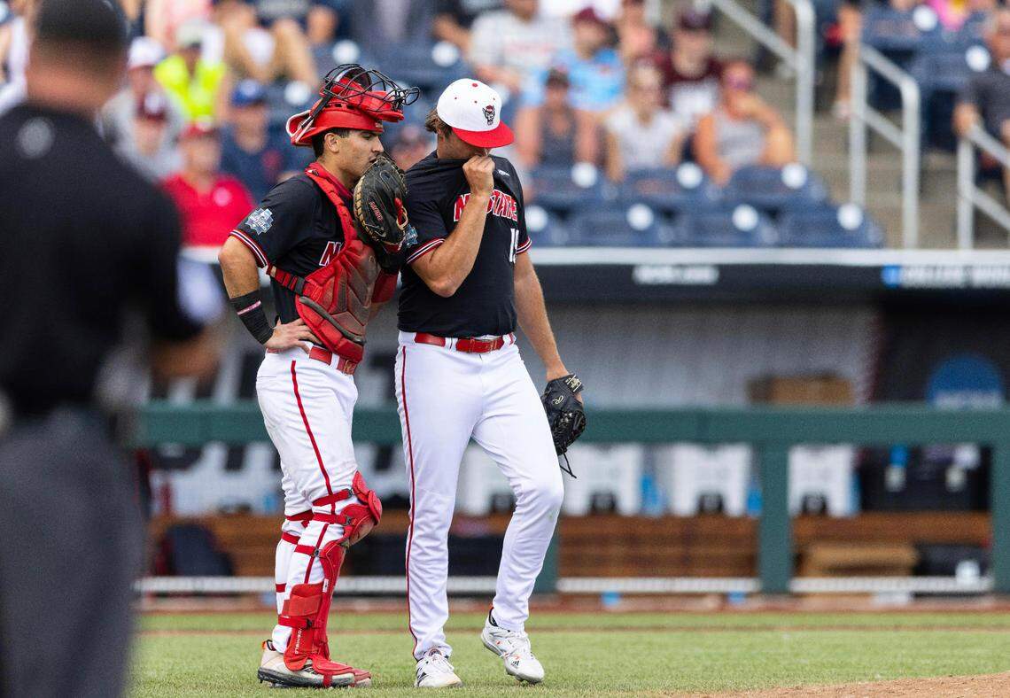 North Carolina State catcher Luca Tresh, left, talks with pitcher Dalton Feeney in the sixth inning during a baseball game against Vanderbilt in the College World Series, Friday, June 25, 2021, at TD Ameritrade Park in Omaha.