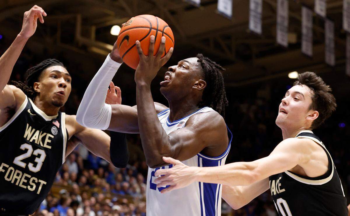 Duke’s Mark Mitchell (25) drives past Wake Forest’s Parker Friedrichsen (20) as he heads to the basket during the second half of Duke’s 77-69 victory over Wake Forest at Cameron Indoor Stadium in Durham, N.C., Monday, Feb. 12, 2024.