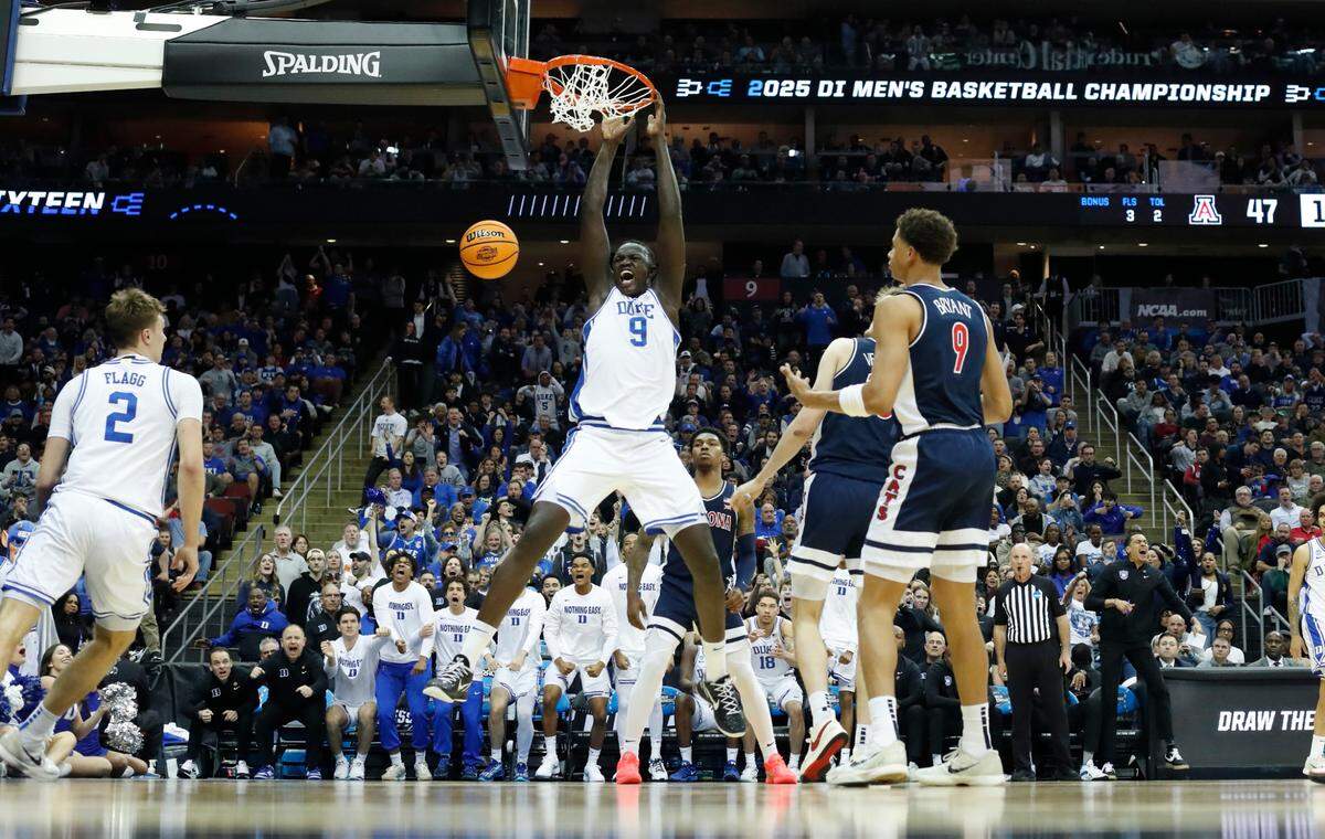 Duke’s Khaman Maluach (9) slams in two during Duke’s 100-93 victory over Arizona in the Sweet 16 round of the 2025 Men’s NCAA Basketball Championship at the Prudential Center in Newark, N.J., Thursday, March 27, 2025.