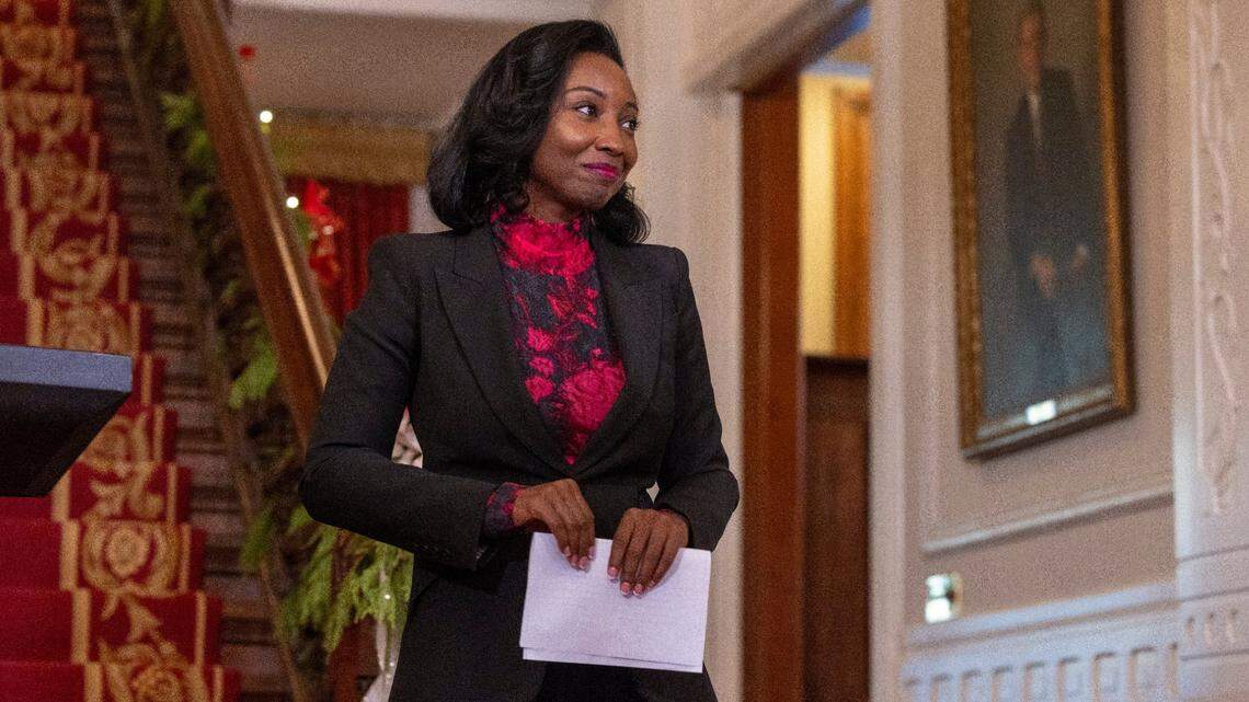 Newly appointed North Carolina State Auditor Jessica Homes steps away from the dais to greet her family at the Executive Mansion on Thursday, November 30, 2023 in Raleigh, N.C. Holmes replaces Auditor Beth Wood who resigned amid scrutiny of her use of state vehicles following a crash in December 2022.