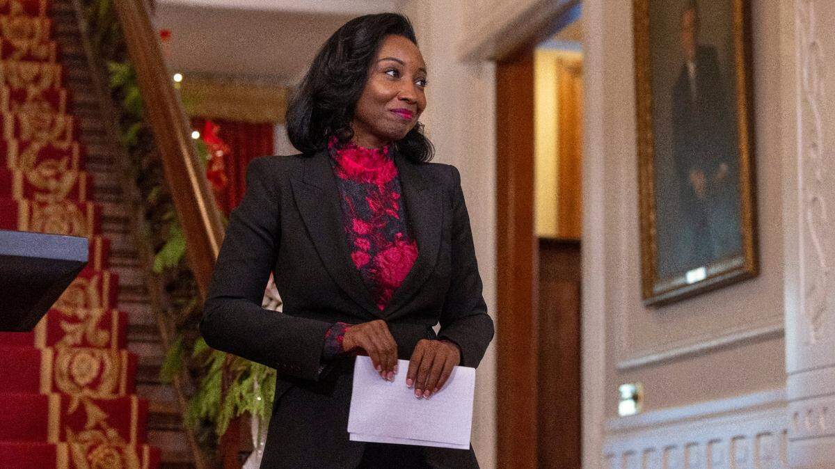 Newly appointed North Carolina State Auditor Jessica Homes steps away from the dais to greet her family at the Executive Mansion on Thursday, November 30, 2023 in Raleigh, N.C. Holmes replaces Auditor Beth Wood who resigned amid scrutiny of her use of state vehicles following a crash in December 2022.