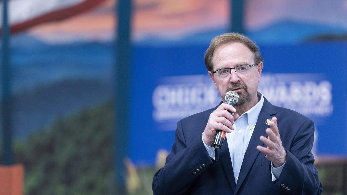 Rep. Chuck Edwards, R-N.C., speaks to a crowd during a congressional town hall meeting on March 13, 2025, in Asheville, North Carolina.