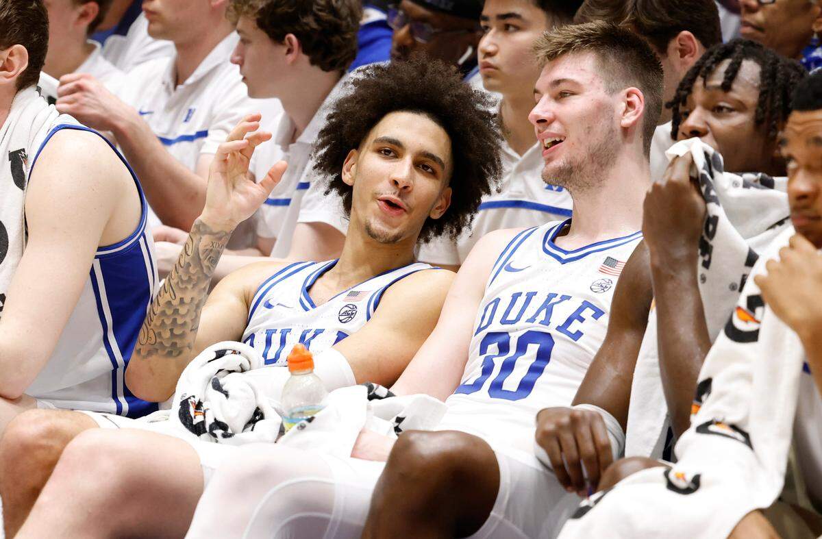 Duke’s Tyrese Proctor (5) talks with Kyle Filipowski (30) late in the second half of Duke’s 73-48 victory over Virginia at Cameron Indoor Stadium in Durham, N.C., Saturday, March 2, 2024.