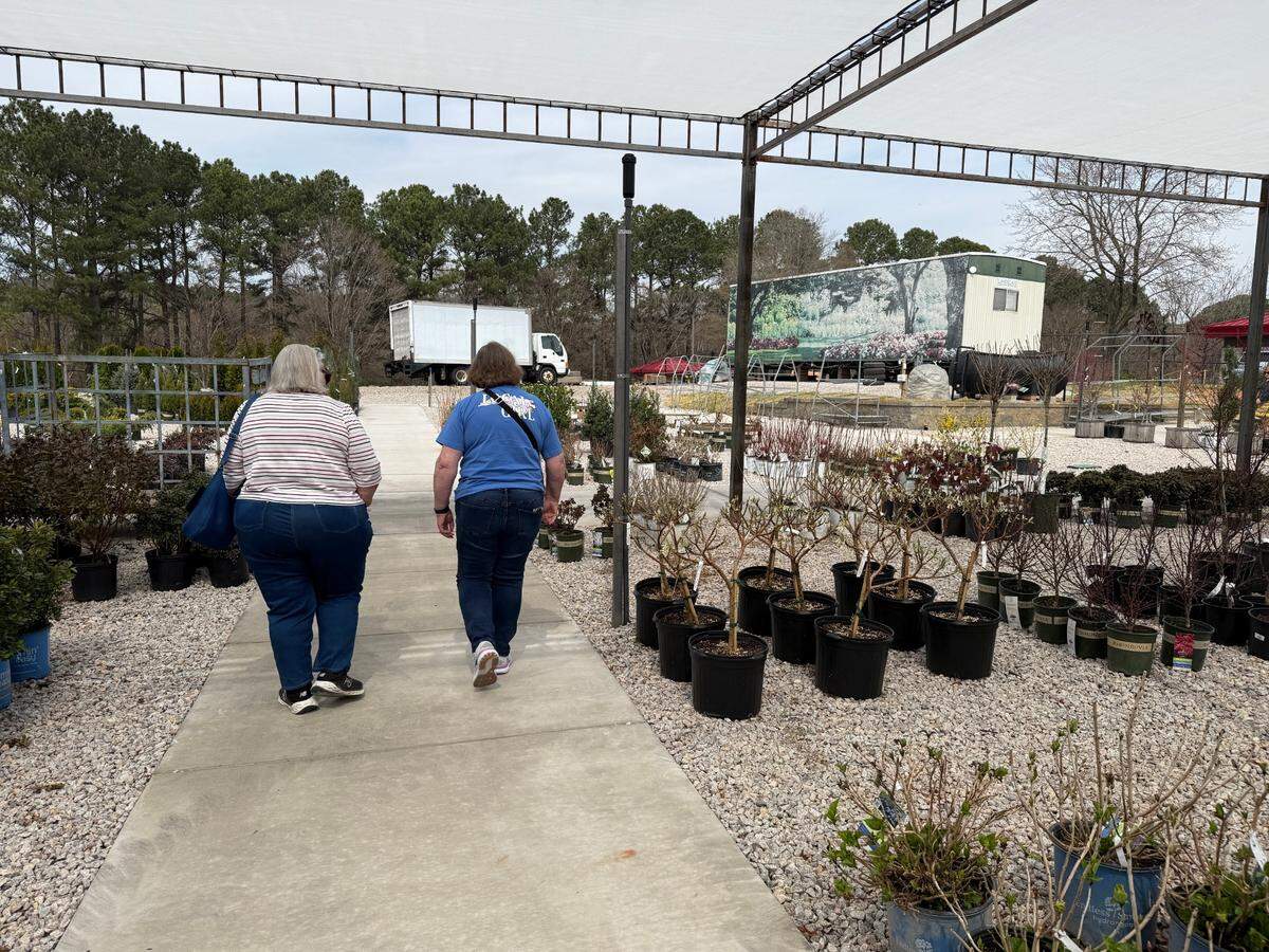 Shoppers browse the grounds at Logan’s Garden Shop’s new State Farmers Market store in Raleigh, North Carolina on Thursday, March 13, 2025.