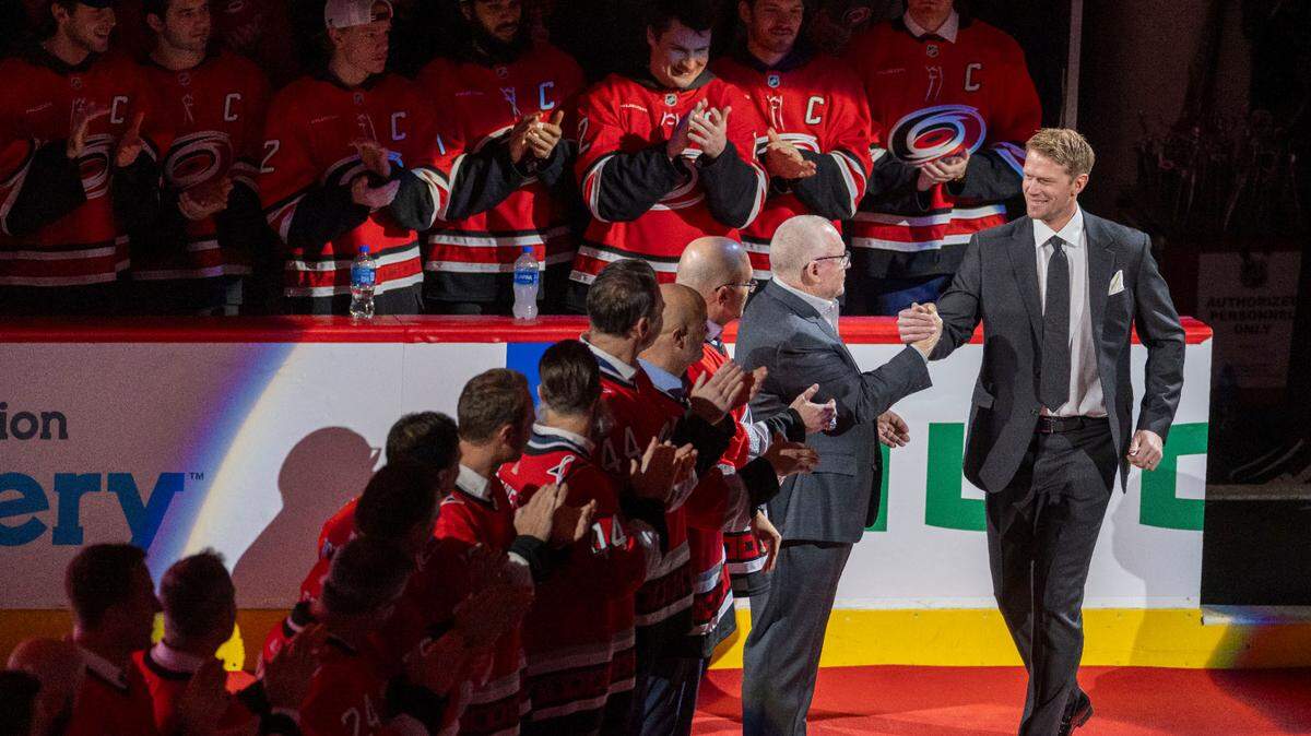 Jim Rutherford, former general manager for the Carolina Hurricanes, greets Eric Staal as he is introduced for the retirement of his jersey on Sunday, January 12, 2025 at Lenovo Center in Raleigh, N.C.
