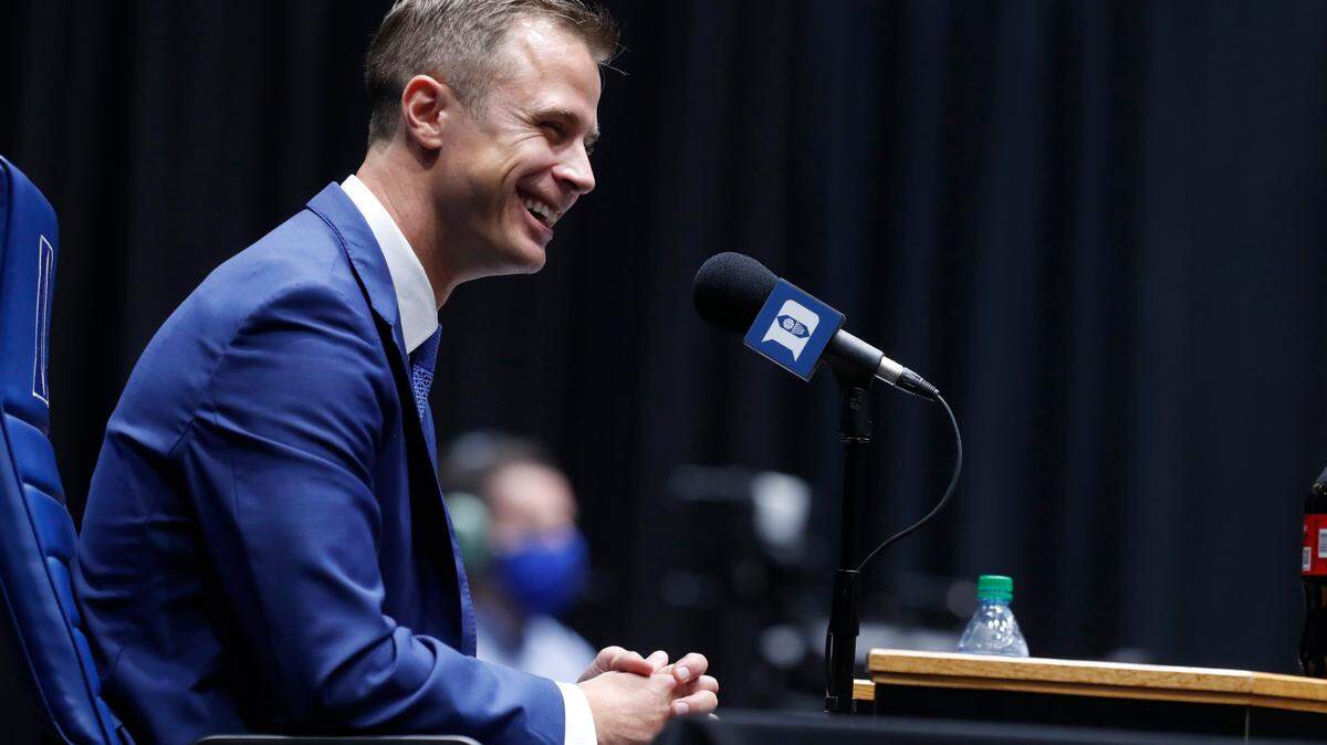 Jon Scheyer laughs during a press conference where he was introduced as Duke basketball’s 20th head coach at Cameron Indoor Stadium in Durham, N.C., Friday, June 4, 2021.