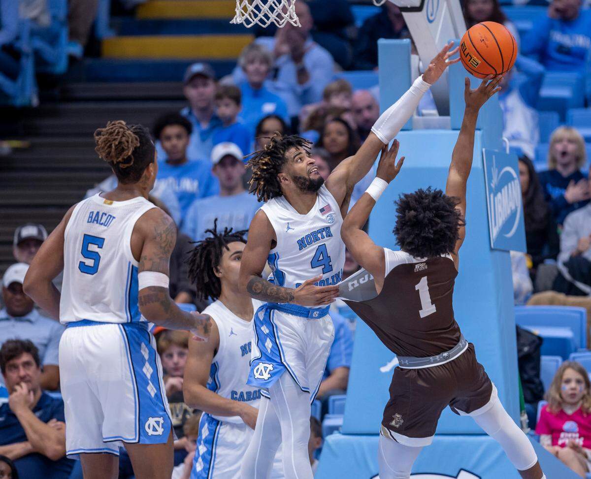 North Carolina’s R.J. Davis (4) blocks a shot by Lehigh’s Nasir Whitlock (1) in the second half on Sunday, November 12, 2023 at the Smith Center in Chapel Hill, N.C.