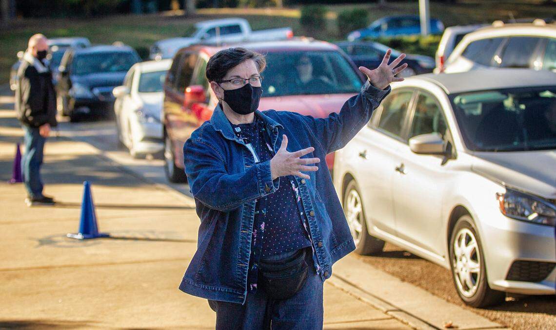 Chrys Browne, a Wake County Public Schools central office worker, helps with morning carpool at Aversboro Elementary School in Garner Tuesday, Nov. 9, 2021. Avensboro has a 20 percent teacher vacancy rate.