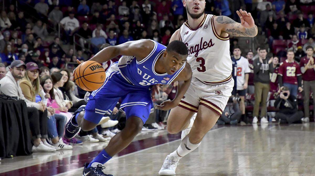 Duke’s Jaylen Blakes (2) drives past Boston College’s Jaeden Zackery (3) on the way to the basket during the first half of an NCAA college basketball game, Saturday, Jan. 7, 2023, in Boston. (AP Photo/Mark Stockwell)