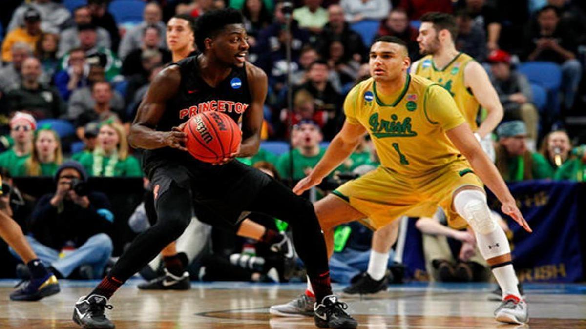 Notre Dame Austin Torres, right, defends Princeton guard Myles Stephens, left, during the first half of a first-round men's college basketball game in the NCAA Tournament, Thursday, March 16, 2017, in Buffalo, N.Y. (AP Photo/Jeffrey T. Barnes)