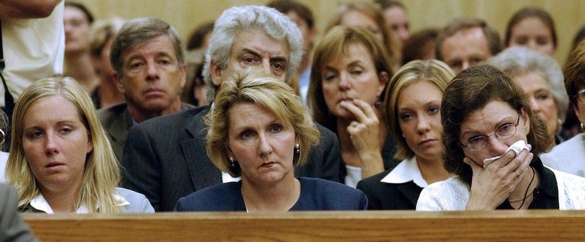 Family and friends of Kathleen Peterson listen as opening statements are made in the Michael Peterson murder trial Tuesday July 1,2003 at front from left to right are Caitlin Atwater (daughter), Candace Zamperini (sister) , and Lori Campell (sister).