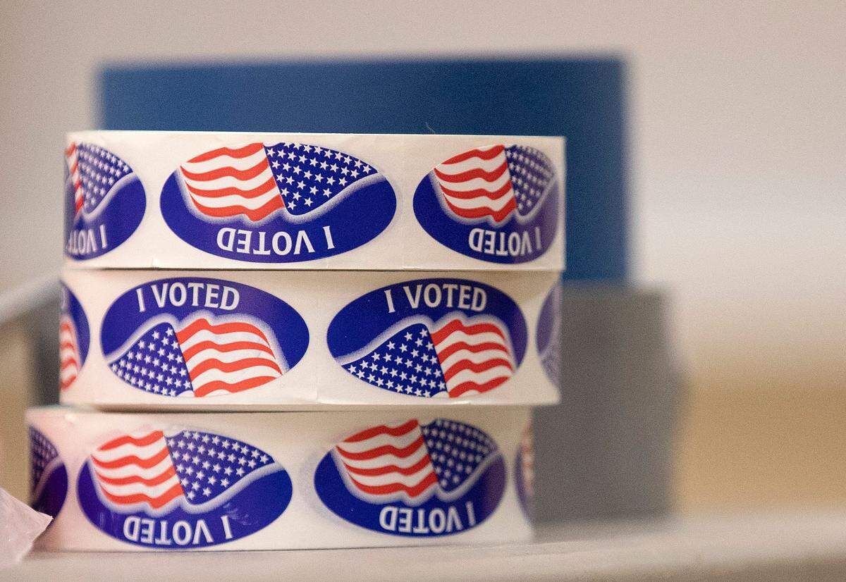 Rolls of stickers await voters at Aversboro Elementary School on Tuesday, March 5, 2024, in Garner, N.C.