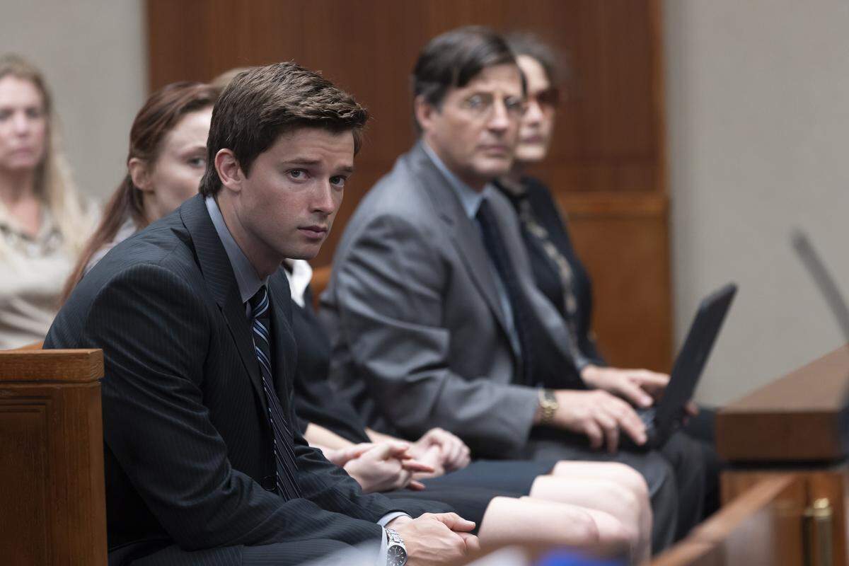 Patrick Schwarzenegger as Todd Peterson and Tim Guinee as Bill Peterson in the HBO Max series “The Staircase.”