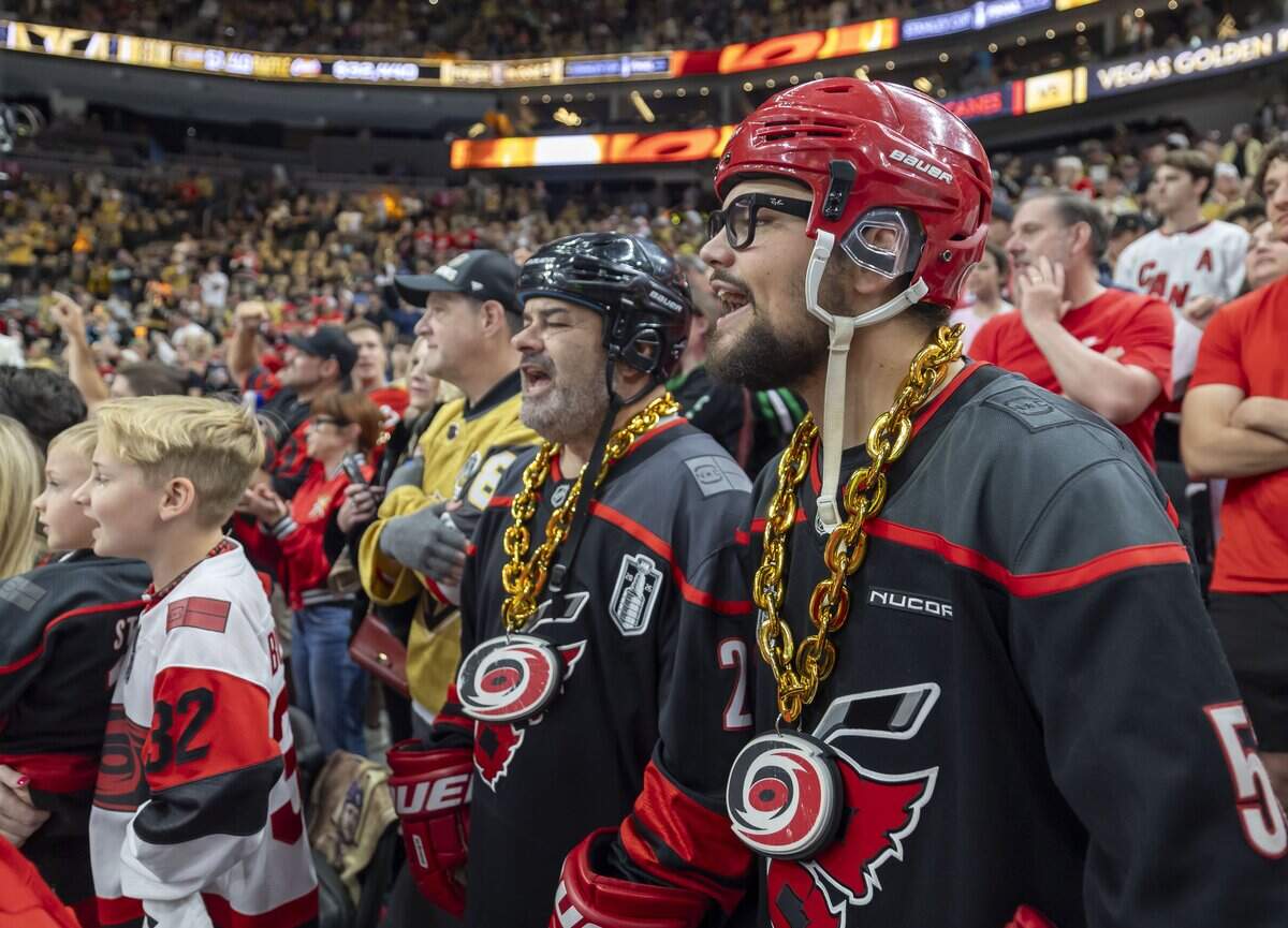 Nicholas Torri and his father Bill Torri of Clayton, N.C., watch the Carolina Hurricanes warm up for Game 6 of the Stanley Cup Final, on Sunday, June 14, 2026 at T-Mobile Arena in Las Vegas, NV.
