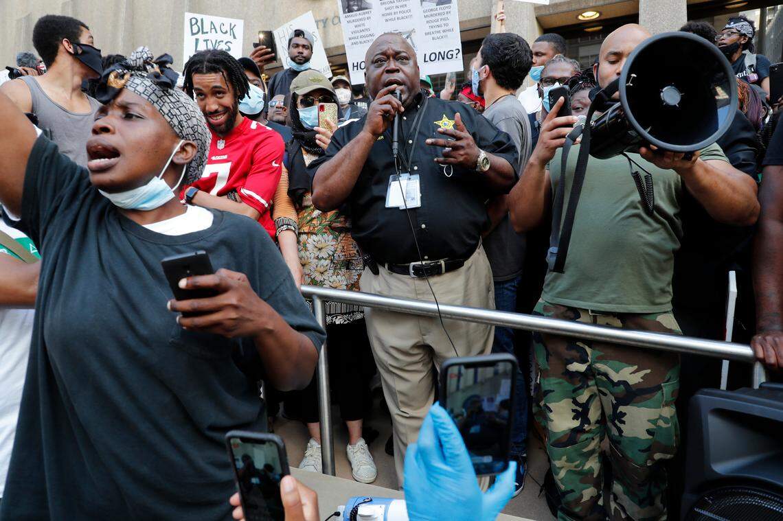Wake County Sheriff Gerald Baker speaks to the crow during a protest in downtown Raleigh, N.C. Saturday, May 30, 2020.