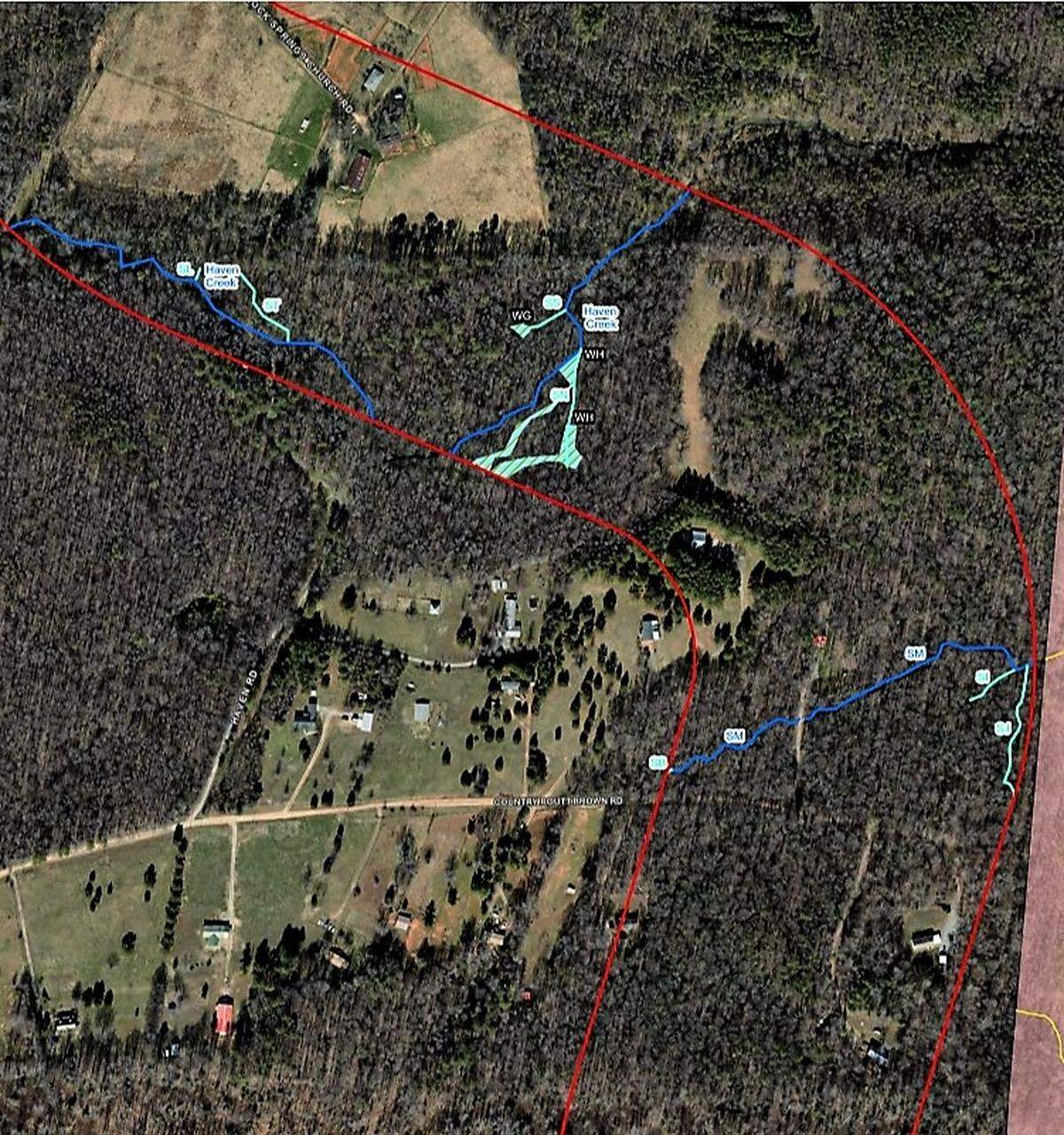 Chatham Park developers and NCDOT are drafting plans to run the development’s main road through the edge of the North Woods neighborhood. The red lines show the area the could be affected. The pink area (at bottom right) is Chatham Park’s property line.